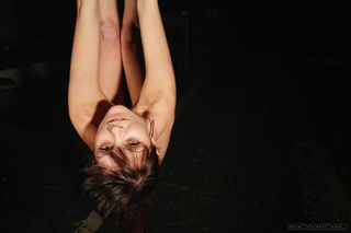 suspended naked girl suffering